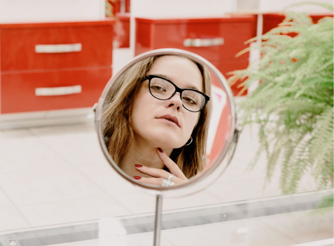 Girl checking out new glasses